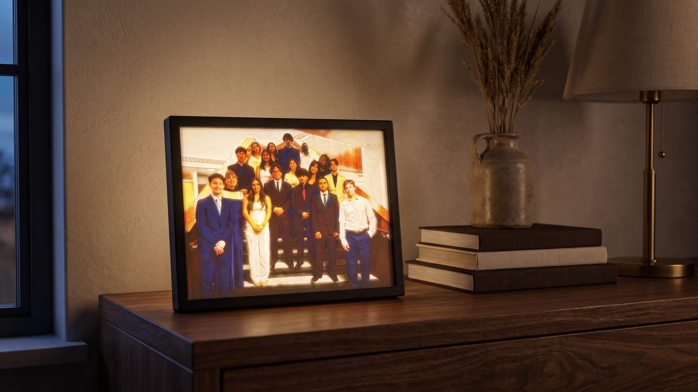 A photo lithophane lit from behind on a console table, revealing a group photo in full colour